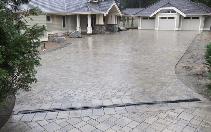 Paving stone driveway in front of a three-car garage