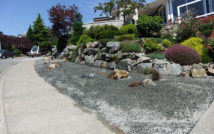Front garden landscaped with large rocks